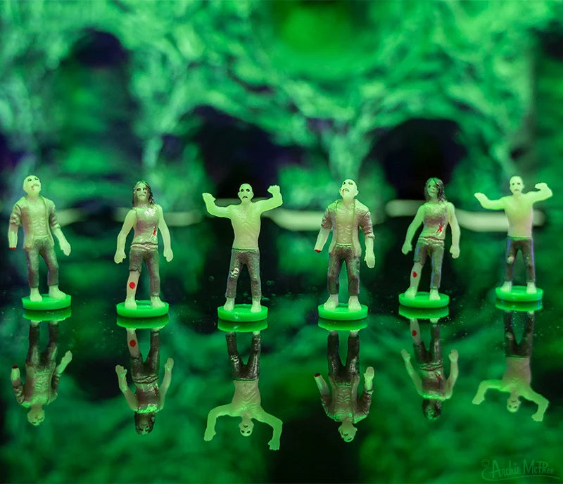 Itty Bitty Zombies green zombie figures displayed on reflective bases
