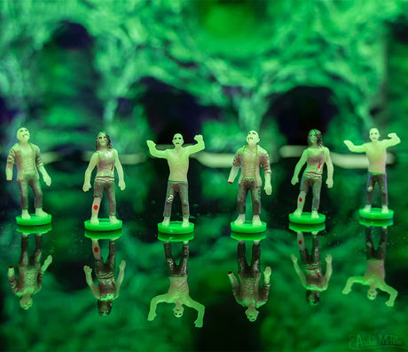 Itty Bitty Zombies green zombie figures displayed on reflective bases