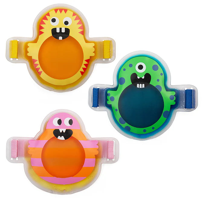 Three colorful Oopsie Monster Hot and Cold Packs with cute monster faces and adjustable straps for kids’ comfort.