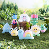 Momiji Magical Meadow Sidekick Blind Box featuring colorful plush characters in a whimsical meadow scene