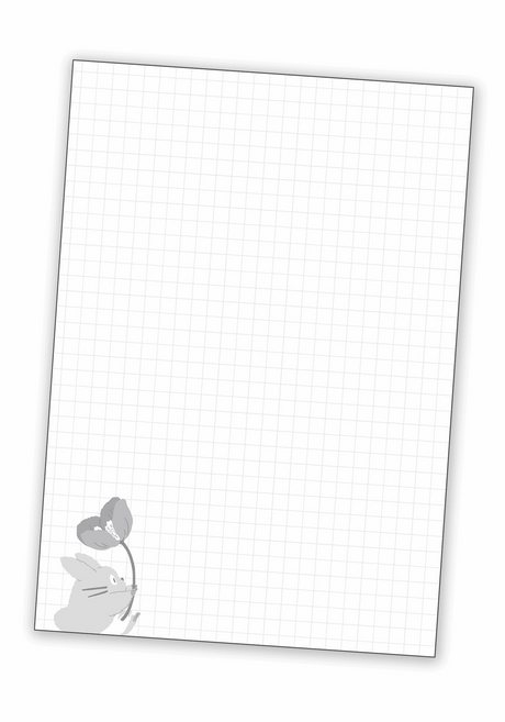 Inside page of B6 notebook, graph paper with small detailed cartoon of Totoro holding a flower in the bottom left corner.