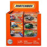 Display box of Matchbox vehicles featuring six different miniature die-cast cars with detailed designs and real rolling wheels