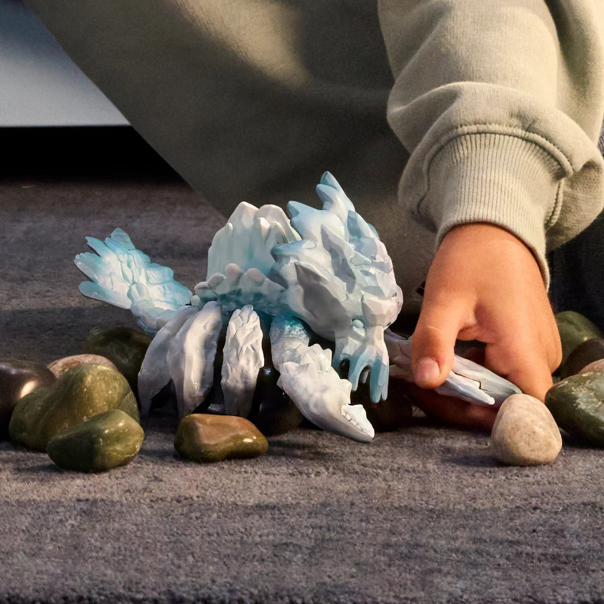 Eldrador Creatures | Ice Crab icy creature toy with translucent blue details among rocks