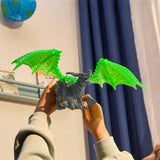 Eldrador Creatures | Rock Dragon with bright green wings held up for display