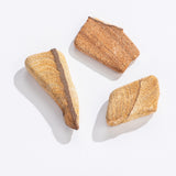 Three pieces of Rock | Tumbled Sandstone with natural textures and warm tan colors on a white background.