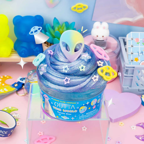 Outta This World Metallic Slime in a jar with shimmering purple-blue slime, star sprinkles, and colorful space charms.