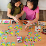 Two children playing Meadow Memory Match & Make Game with colorful illustrated cards