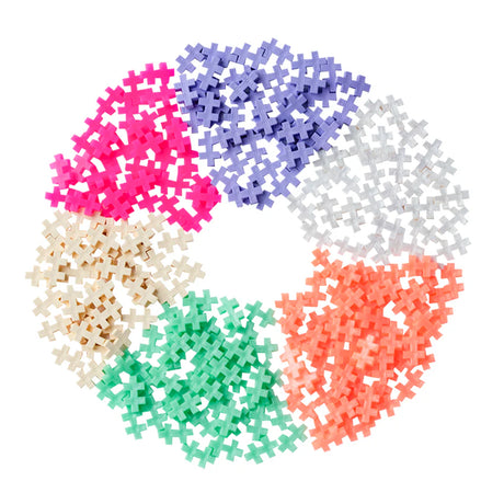 Plus Plus Pearl 240pc colorful interlocking pieces arranged in a circular pattern for creative play and STEM learning.