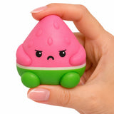 The Pits Grumpy Fruits pink and green grumpy fruit toy held in a hand