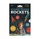 Child excitedly playing with colorful flying paper rockets and space-themed stickers kit packaging