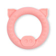 Soft pink pig-shaped baby teether rattle designed as a baby’s first toy with textured grip areas