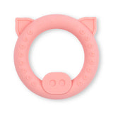 Soft pink pig-shaped baby teether rattle designed as a baby’s first toy with textured grip areas