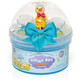 Rainy Day Parade Clear Slime with glittery blue slime, trenchcoat duck charm, and cloud confetti in clear dome packaging.