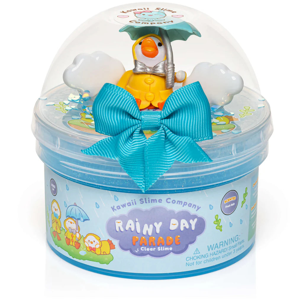 Rainy Day Parade Clear Slime container with blue slime, duck charm holding umbrella, and decorative blue bow.