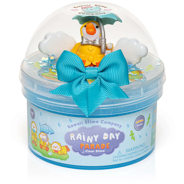 Rainy Day Parade Clear Slime container with blue slime, duck charm holding umbrella, and decorative blue bow.