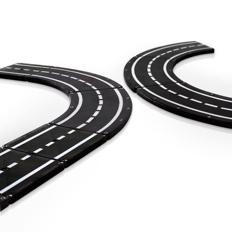 Magnatiles Xtras Roadway 12pc showing magnetic black road pieces forming curved and straight sections for building tracks.