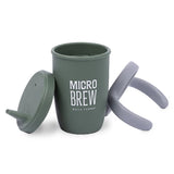Green silicone sippy cup with "Micro Brew" text, removable lid and gray handles, durable and leak-resistant design.