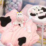 Straw-Dairy Cow 2 Slimes in 1 with glossy pink slime, clay cow topper, and milk bottle detail.