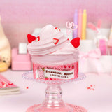 Strawberry Mousse Butter Slime in a jar with creamy pink texture and strawberry charms on top, soft and stretchable slime.
