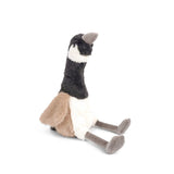 Seated plush penguin with a black and white body, tan sides, and long gray legs
