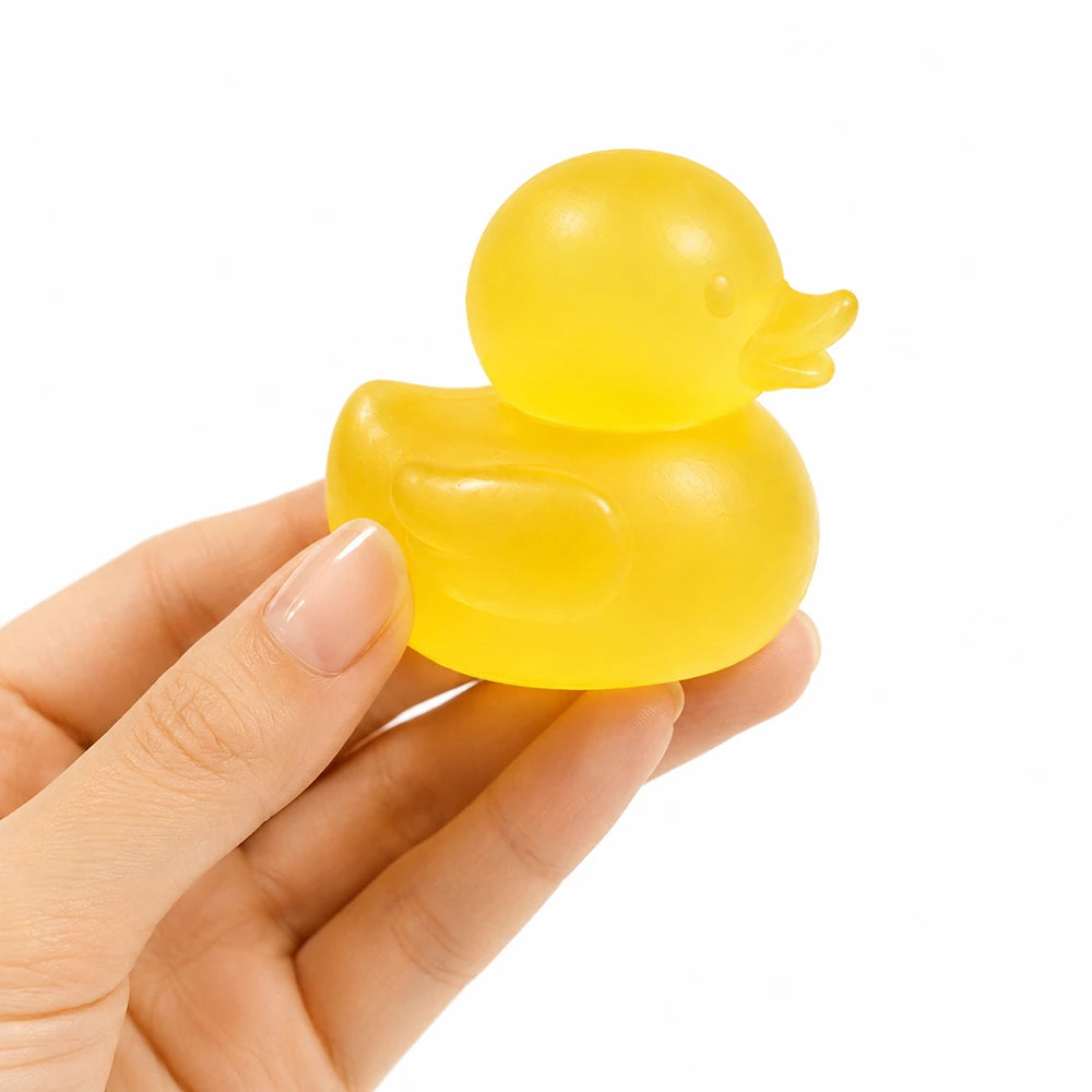 Super Duper Sugar Squisher | Mini Ducks yellow duck toy held in a hand