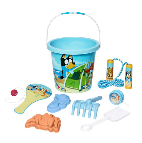 Blue plastic bucket with beach scene and matching toys including paddle, jump rope, rake, shovel, and sand molds