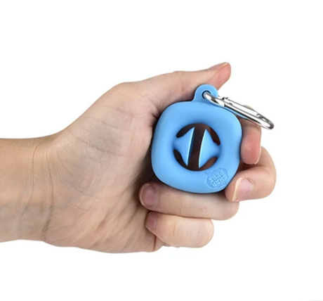 Hand holding a blue Mini Snapperz Keychain with suction cups for stress relief and fidgeting.