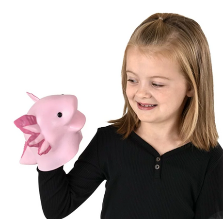 Young girl playing with a pink Axolotl Hand Puppet, smiling and enjoying imaginative play.