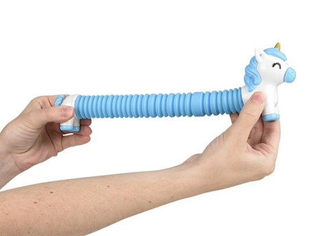 Hands stretching a blue Unicorn Fidget Pop Tube toy with an accordion design, fun for kids aged 3 and up.
