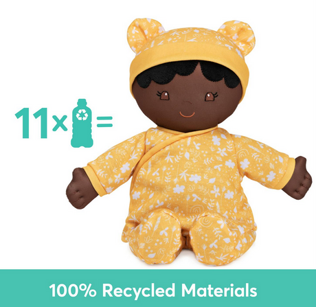Recycled Baby Doll | Camellia with embroidered face and floral yellow onesie made from 100% recycled materials.