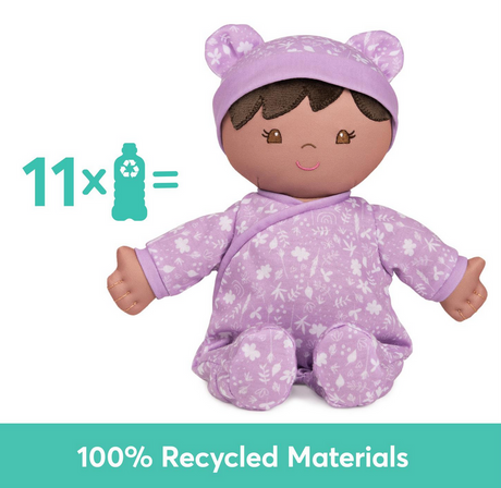 Recycled Baby Doll | Leilani wearing floral purple onesie, made from 100% recycled materials, soft and cuddly doll.