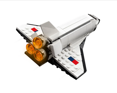 Creator Space Shuttle toy model with detailed white design and glowing orange engine thrusters on the back wings.