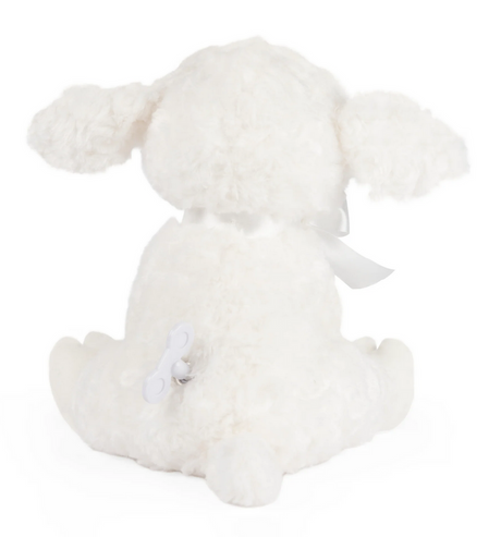 Musical Lamb Lena sitting with white plush fur, satin ribbon, and wind-up key for Brahms’ Lullaby music.