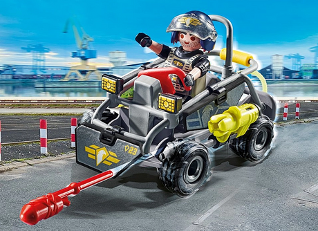 City Action | Tactical Unit Multi-Terrain Quad with officer figure driving on a city road, featuring rugged wheels and action gear.