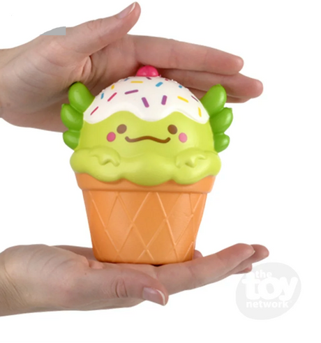 Hands holding a 5" Squishy Axolotl Foodie Friend soft foam ice cream cone with axolotl head and sprinkles.