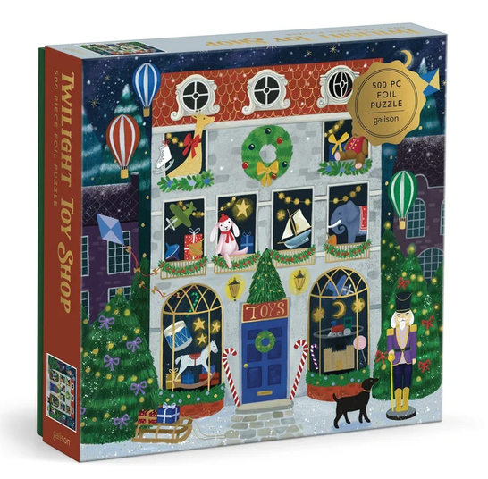500pc Twilight Toy Shop Foil Puzzle featuring a festive toy shop scene with snowy windows and holiday decorations