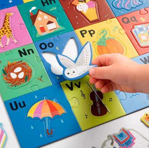 52pc My ABC's Giant Floor Puzzle with colorful alphabet pieces and a hand placing an owl piece