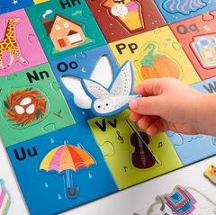 52pc My ABC's Giant Floor Puzzle with colorful alphabet pieces and a hand placing an owl piece
