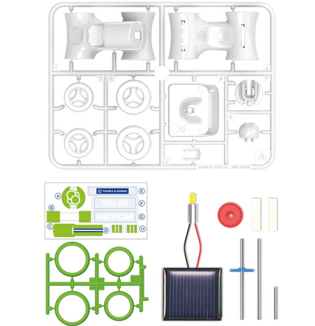Solar Race Car kit parts laid out including solar panel, wheels, body pieces, and motor for easy snap-together assembly.