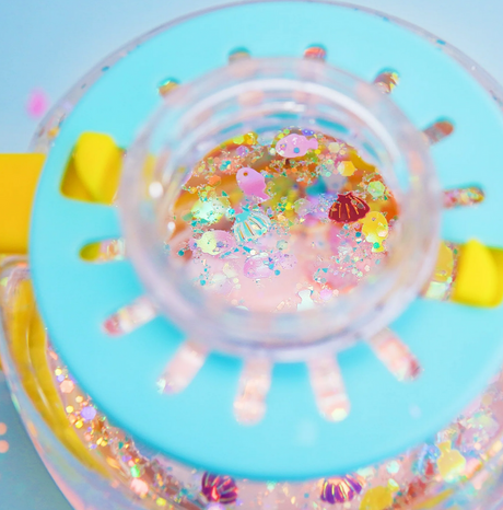 Sensory Jar Fun Fillers | Under the Sea with colorful sea-themed sensory accessories inside a clear jar lid.