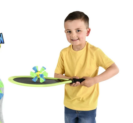 Child playing with the Jumbo Badminton Set featuring bright green racket and colorful bouncy birdie for backyard fun.