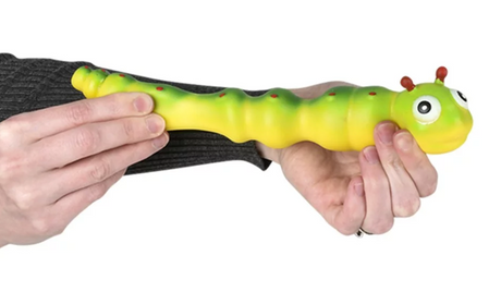 Hands stretching a green and yellow Stretchy Sand Caterpillar toy with a smooth silicone exterior.