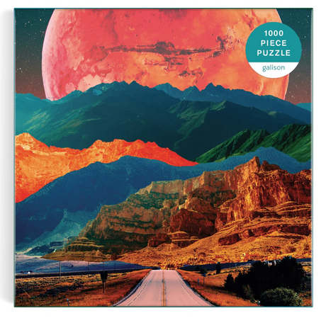 1000pc Cosmic Highway Puzzle featuring surreal colorful mountain landscape beneath a large red planet in the sky.