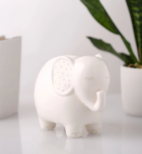 Ceramic Elephant Money Bank in white with gray accents, featuring a removable stopper for safe savings.