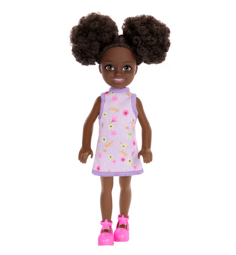Barbie Chelsea #96 doll with curly hair in purple floral dress and pink star shoes for creative dress-up fun.