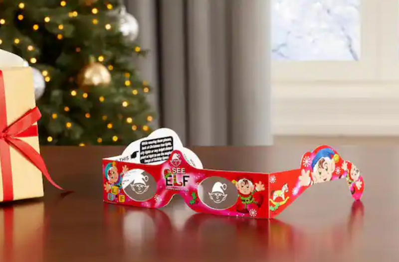 Holiday Specs | Elf featuring colorful 3D paper glasses with festive Christmas elf design on a wooden table.