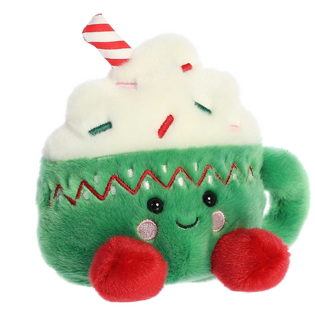 Palm Pals Hot Cocoa Candace plush green cocoa mug with whipped cream, sprinkles, red striped straw, and red feet.