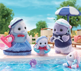 Seal Family plush toys by the pool, featuring father, mother, and baby seals with marine-style clothes and accessories.