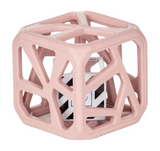 Chew Cube | Mauve features a soft textured teether cube with black and white rattle inside for sensory stimulation.
