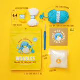 Woobles Crochet Kit | Pierre the Penguin with yarn, crochet hook, stuffing, eyes, needle, and step-by-step video instructions